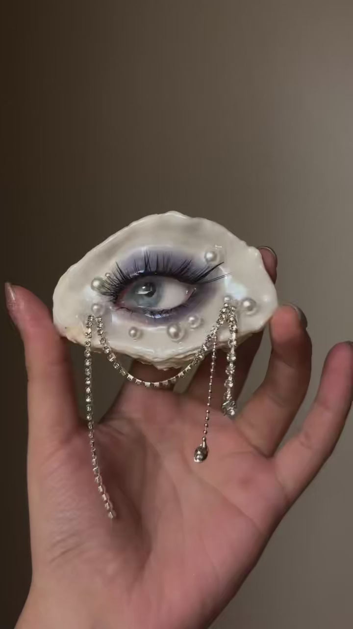 Methyst Haze LV028-R — handheld view showing pearl and rhinestone drapes